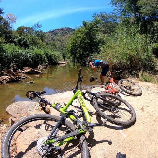 Cyclist resting alongside the Zambezi Bike Trail | Outland Escape