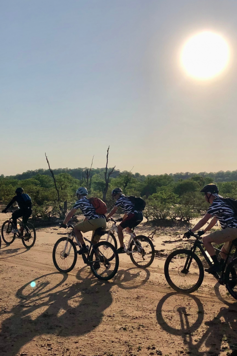 Cyclists riding through Botswana Cycle Tour | Outland Escape