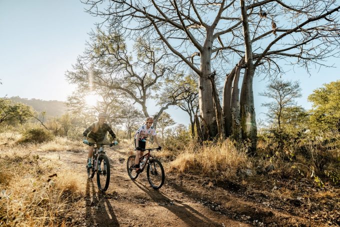 Cyclists riding through Selati Game Reserve | Outland Escape